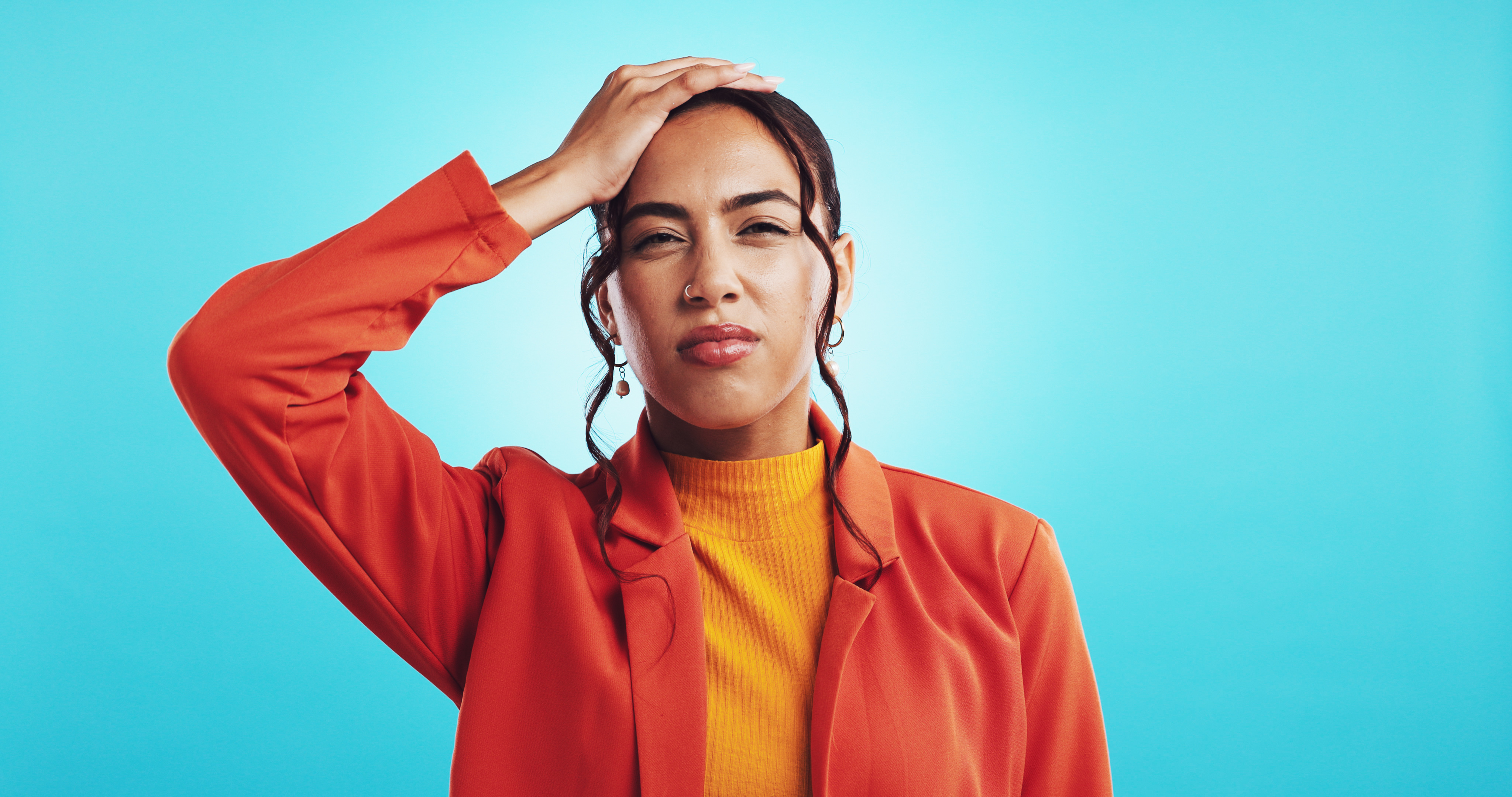 Frustrated marketer holding her head after getting contradictory results from her Meta ad analysis